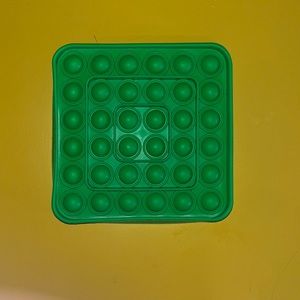 Green square bubble pop it toy